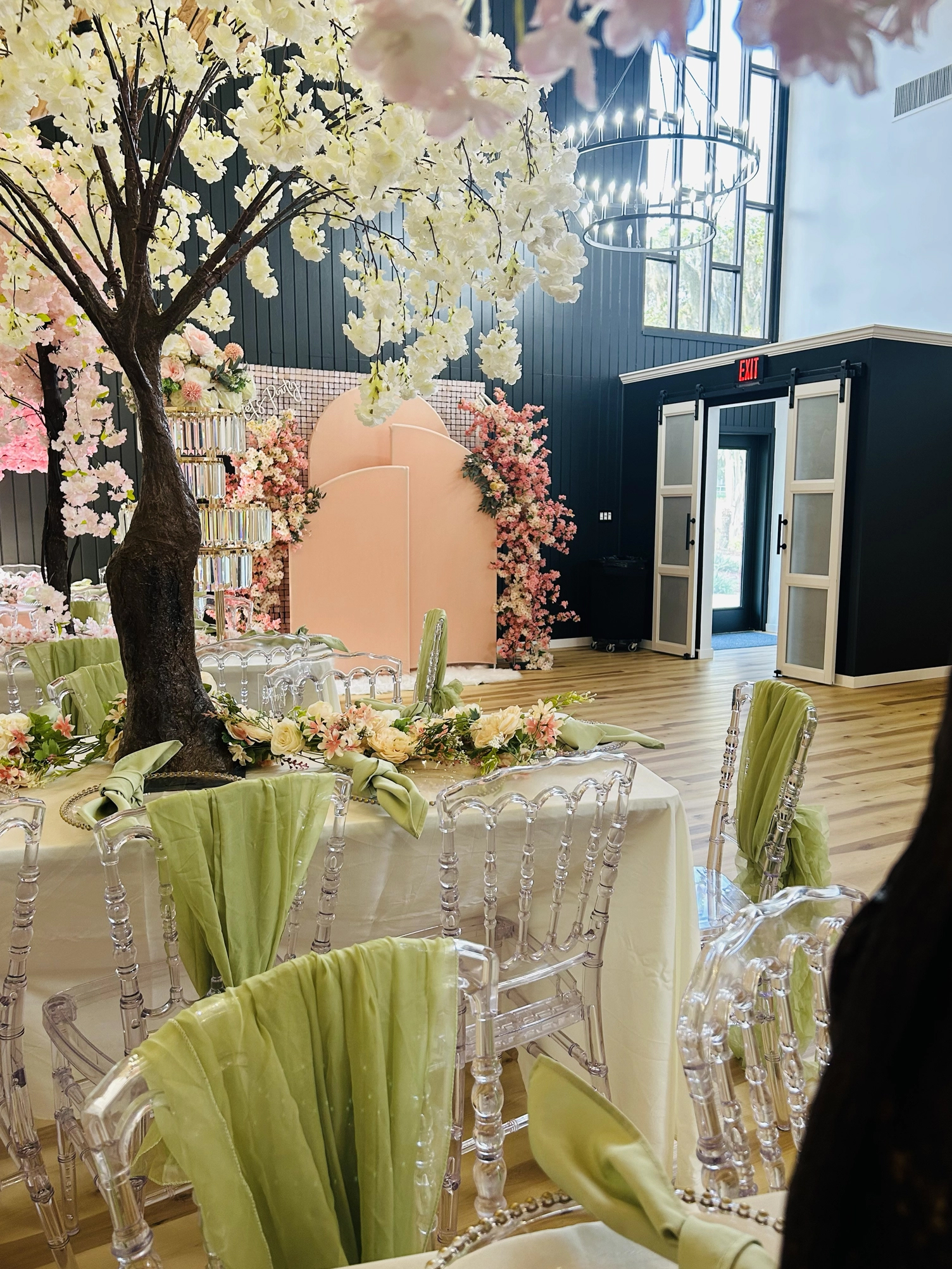 Festive celebration venue setup pink green lighting